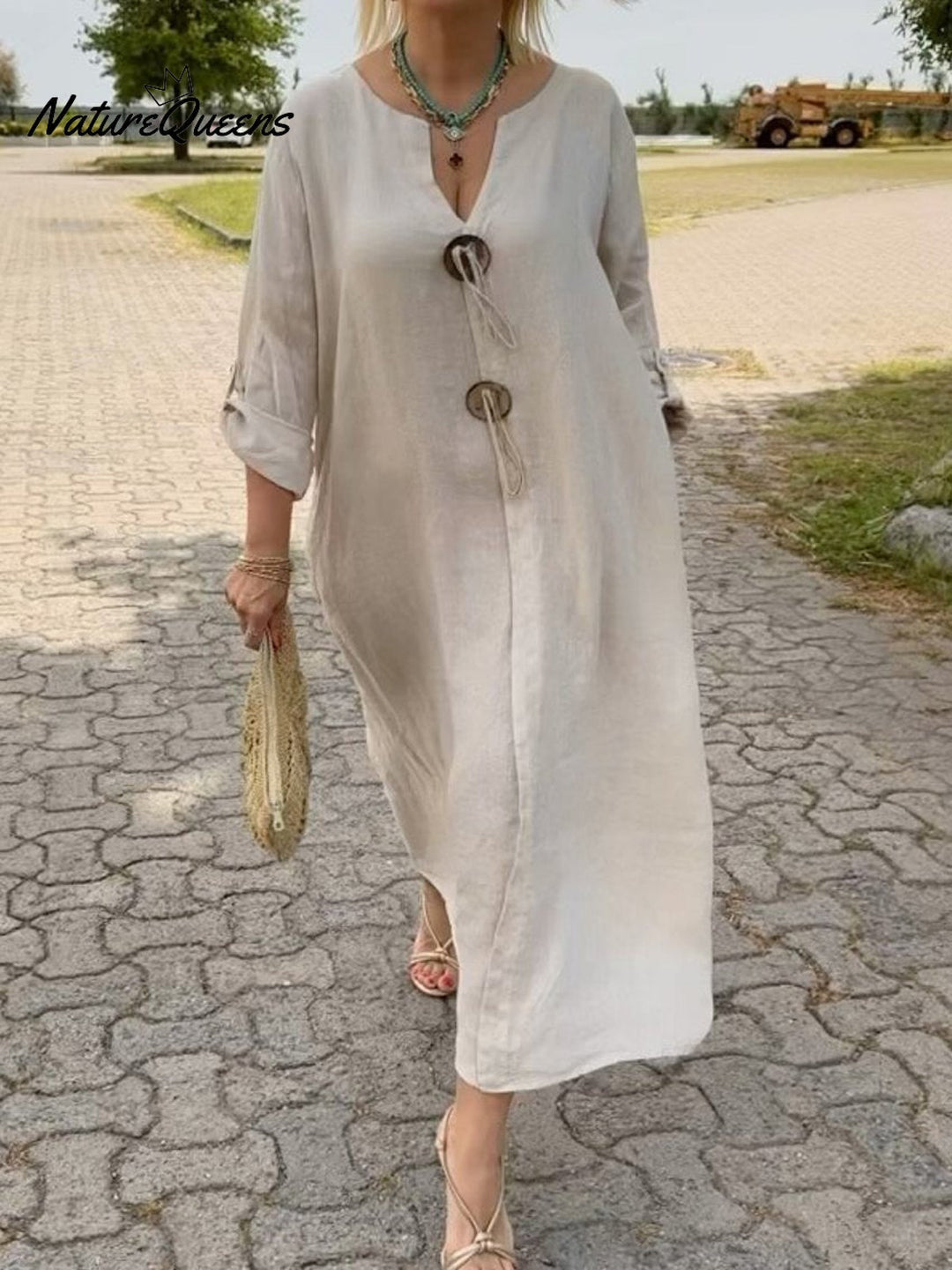 Noor – Lange jurk met houten details en losse mouwen