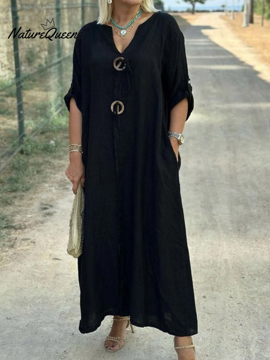 Noor – Lange jurk met houten details en losse mouwen